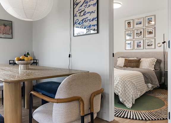 A room with a table and a chair.