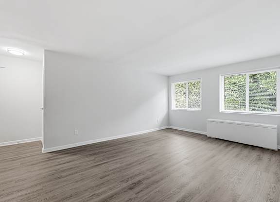 A room with a window and a door.