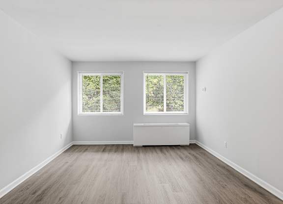 A room with a window and a bench.