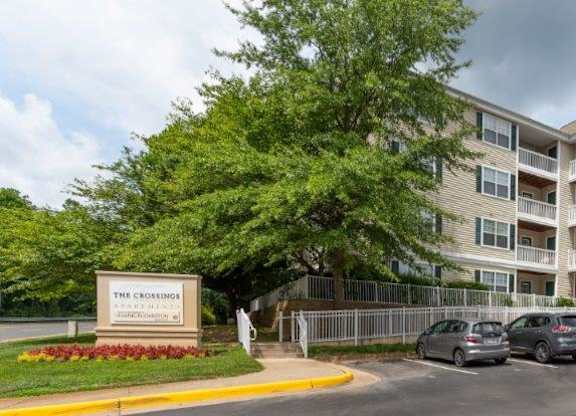 exterior apartment building with cars parked