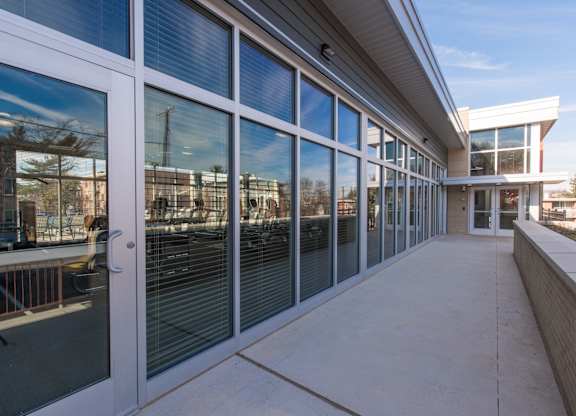 A long building with a lot of windows and a door.