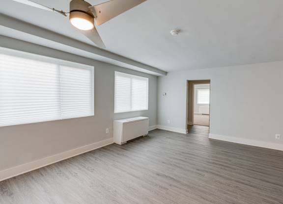 A room with a window and a bench.