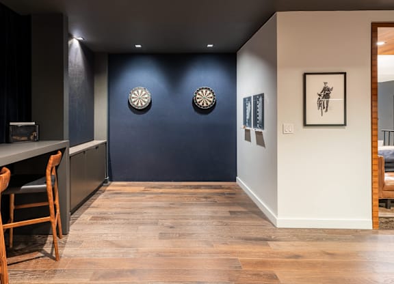 A room with a blue wall and a wooden floor at Clayton on the Park Apartments, Clayton, Missouri