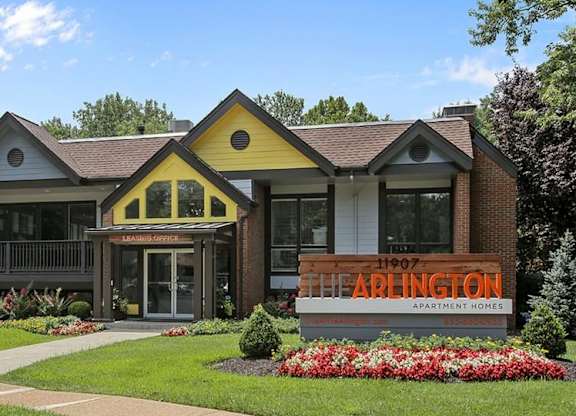 A building with a sign that says Arlington Apartment Homes.