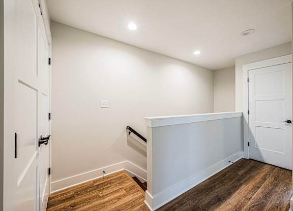 A white door is on the left side of the image.