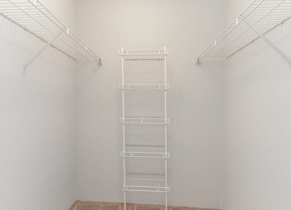 a white room with a ladder in the middle of it