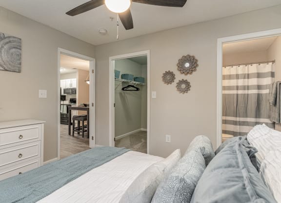 a bedroom with a bed and a closet with a mirror at Litchfield Oaks Apartments, Pawleys Island, SC
