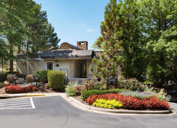 a house with a flower garden in front of it