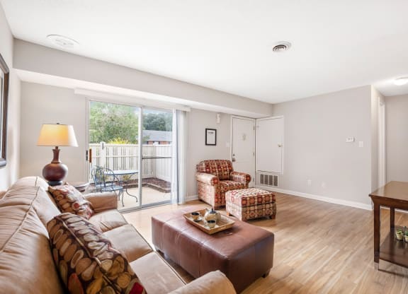 a living room with a couch and two chairs