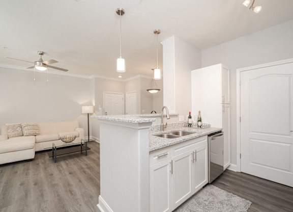 a kitchen and living room with a counter top