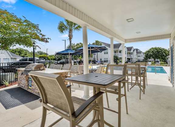 A patio with a table and chairs is shown.