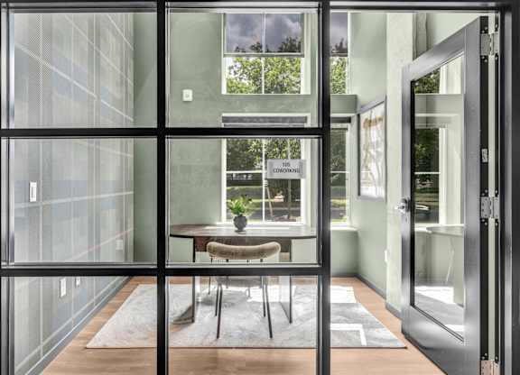 A glass door with a sign that says