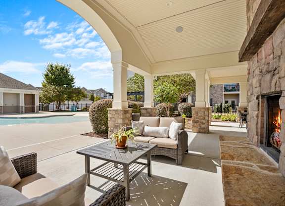 A patio with a table and chairs is shown.