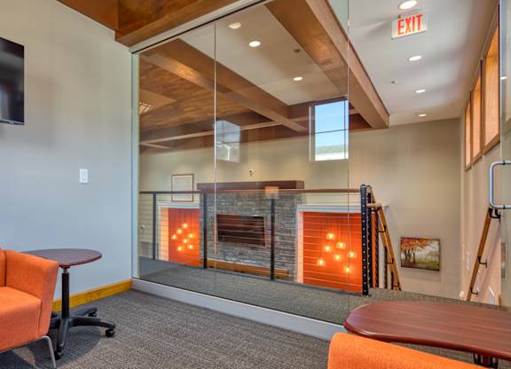 A room with a fireplace and a chair.
