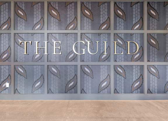 A wall with a pattern and the word