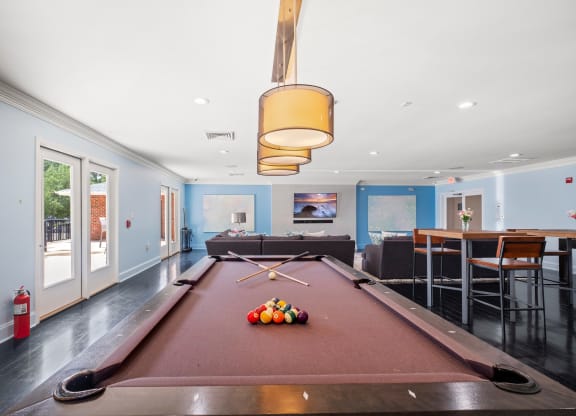 a pool table with a ping pong paddle in the middle of it