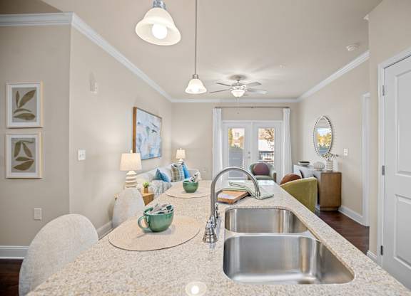 A kitchen with a sink and a counter.