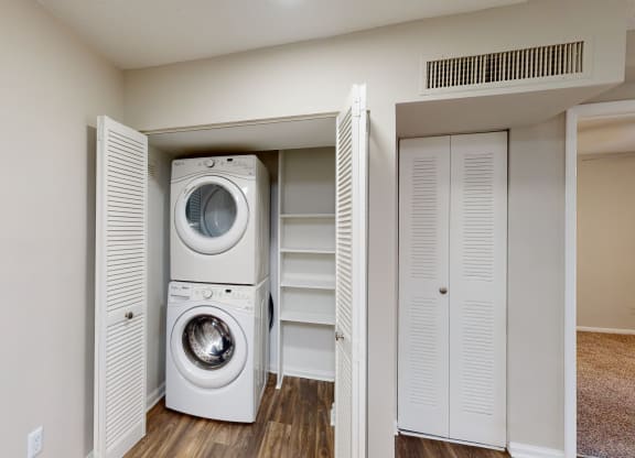 a washer and dryer in a small laundry room