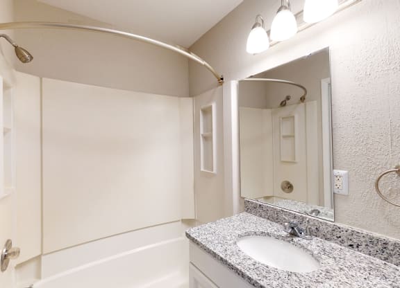 a bathroom with a sink and a bathtub
