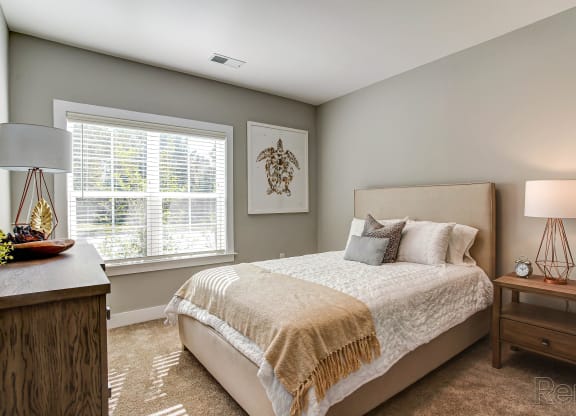 a bedroom with a bed and a window at Barclay Place Apartments, Wilmington, NC, 28412