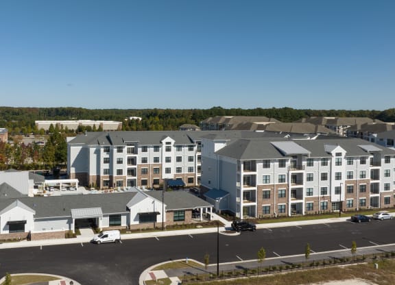 an aerial view of an apartment building in a city
