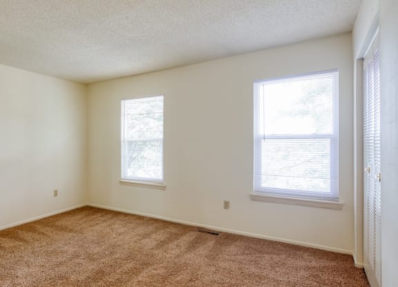 Bedroom with two large windows at The Everett  Apartments in Roanoke, VA 24018