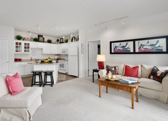 a living room with a couch and a table at The Charleston, Columbus, 43221