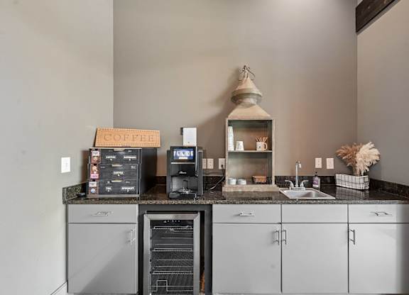 A coffee shop with a counter and a coffee machine.