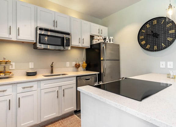 Kitchen With White Cabinetry And Appliances at Litchfield Oaks Apartments, Pawleys Island