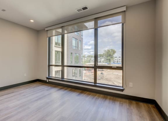 Bedroom With Expansive Windows at The Walker, Cary, NC, 27511
