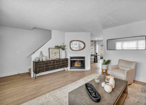 A living room with a fireplace and a couch.