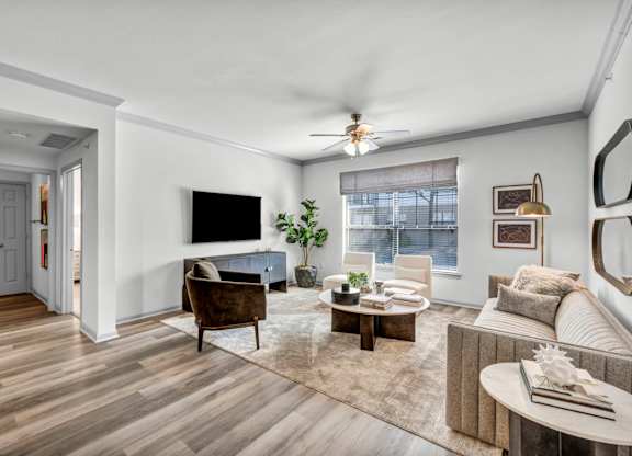 A living room with a brown chair and a brown couch.