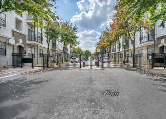 A street view of a residential area with apartment buildings on both sides.