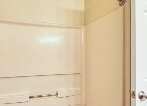 A white door with a handle and a latch.