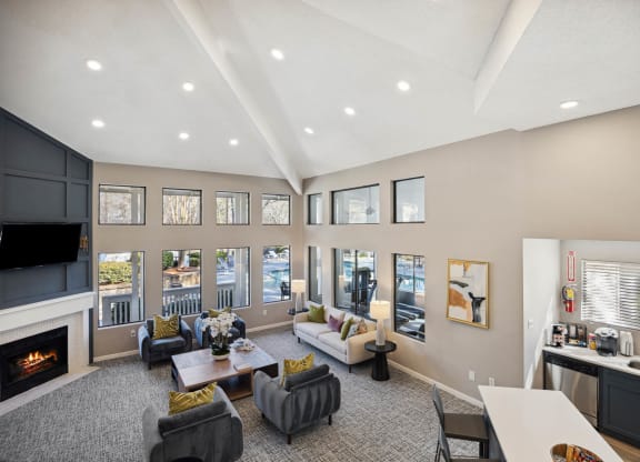 a living room with couches and chairs and a fireplace