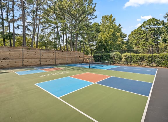 a tennis court with four different courts on it