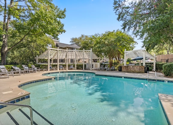 the swimming pool at the preserve at polo garden apartments