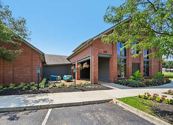 A red brick building with a garage door and a sign that says "Barnes & Noble".