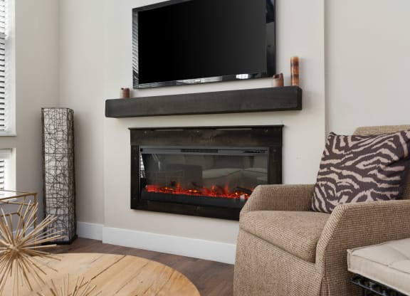 a fireplace with a tv above it in a living room at Hayden Lofts, Ohio, 43016