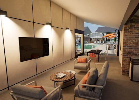 A patio with a couch, chairs, and a television.