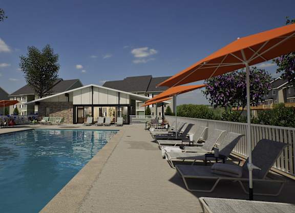 A pool with chairs and umbrellas is surrounded by buildings.