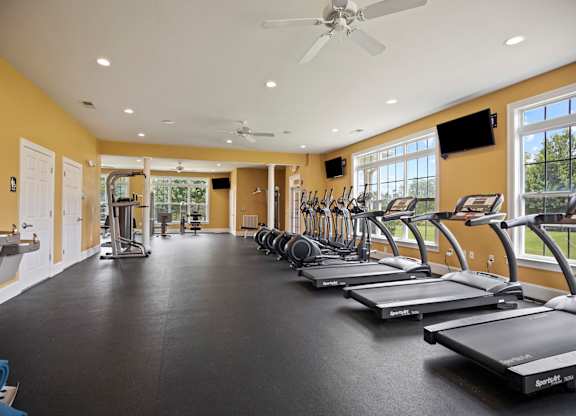 A gym with treadmills and exercise equipment.