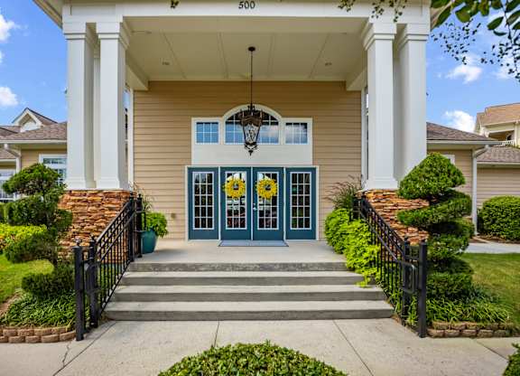 A house numbered 500 with a blue door and a hanging light fixture.