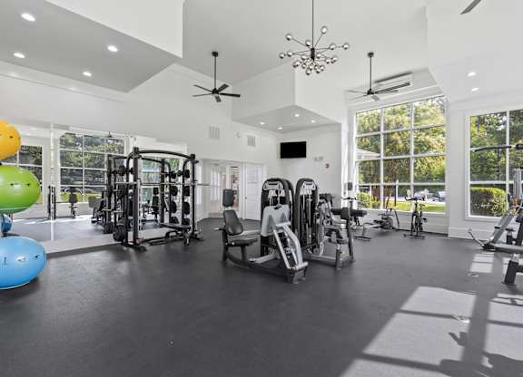 A spacious home gym with a variety of exercise equipment.