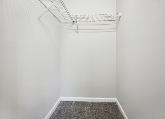a walk in closet in a 555 waverly unit