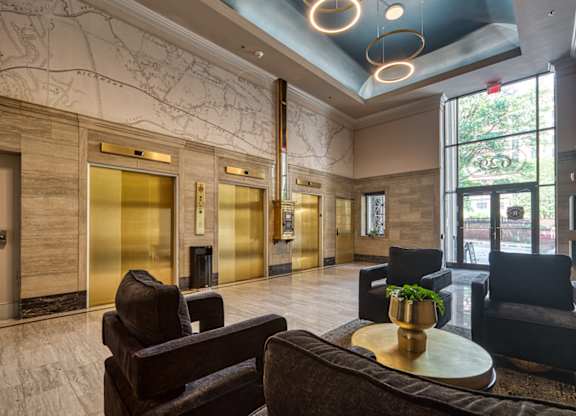 A large room with a blue ceiling and a map on the wall at Residences at Richmond Trust in Richmond, VA