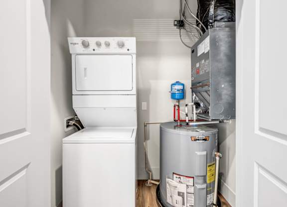 A white oven and dishwasher in a small kitchen.