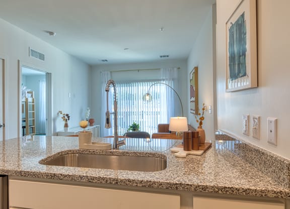 a kitchen with a granite counter top and a sink