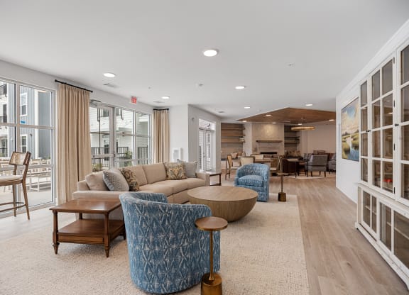 a living room with couches and chairs and a tableat Oak Grove at Blake Farm, Wilmington