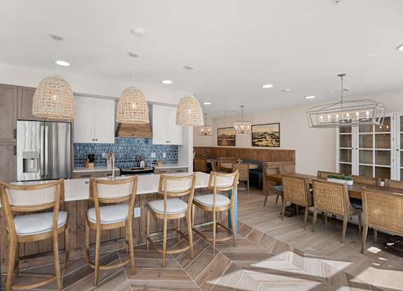 a dining room with a bar and chairs and a kitchen at Blake Farm, North Carolina